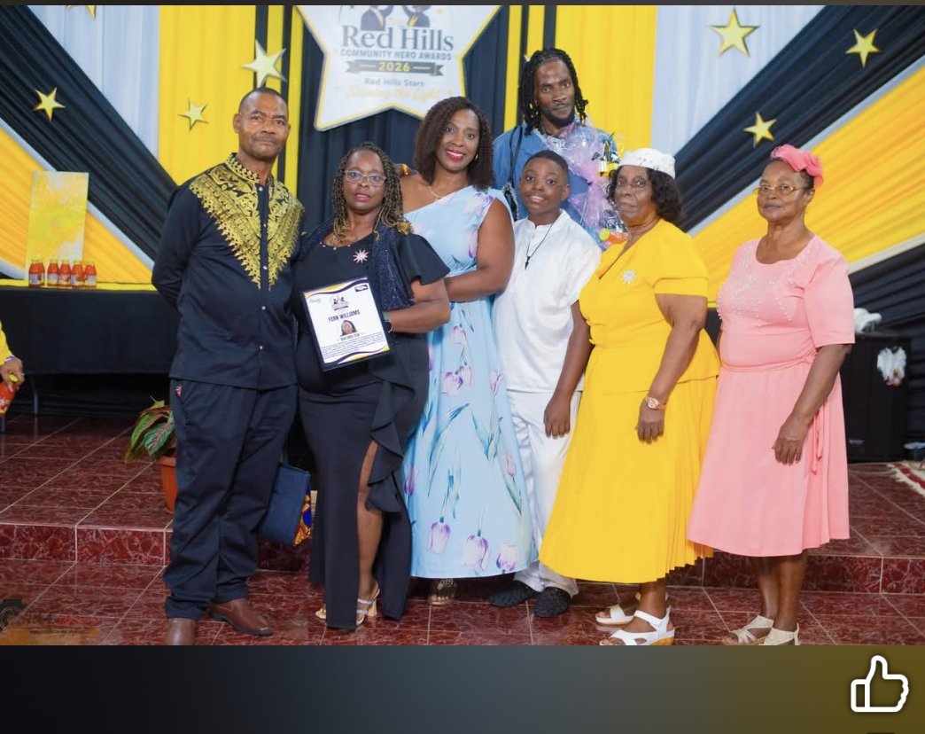 Fern Williams receiving the Community Hero Award in Red Hills, Jamaica